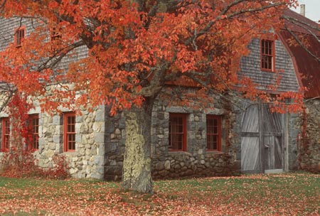 stone barn in fall foliage